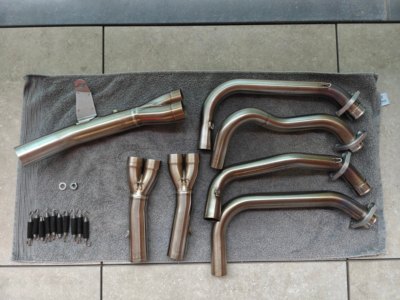 Akrapovic RVS Uitlaatbochten (E-K9R3) - Kawasaki Z900RS/Café, Motoren, Ophalen of Verzenden
