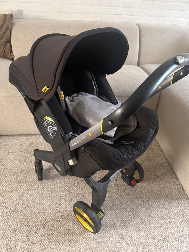 Doona + met regenzeil, doona zak en isofix, Gebruikt, 0 t/m 18 kg, Isofix, Ophalen