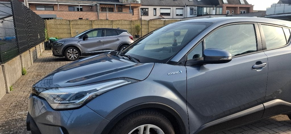 Toyota C-HR 1.8 Hybrid Executive | 61.416 km | 2020, Auto's, Automaat, Dealer onderhouden, Stof, Zwart
