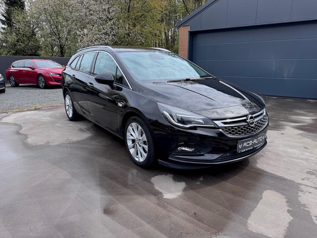 Opel Astra Sports Tourer 1.4 Turbo Innovation Automaat, Auto's, Leder en Stof, Zwart, Opel certified used cars, Bedrijf