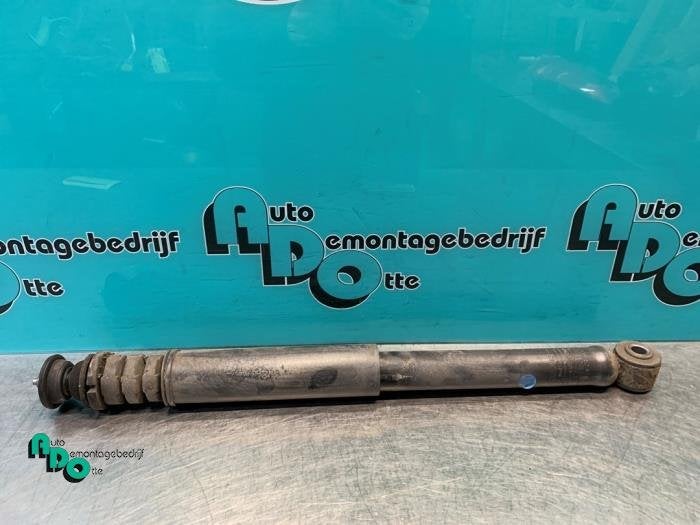 Schokdemper links-achter van een Nissan Note (Note 06-), Gebruikt, -, -, Ophalen of Verzenden