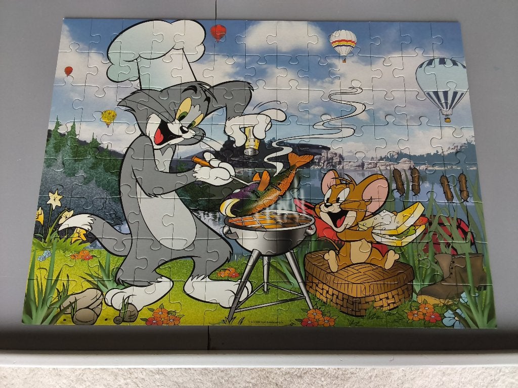 Tom en Jerry puzzel van 100 stukjes - RAVENSBURGER, Ophalen of Verzenden, Meer dan 50 stukjes, Zo goed als nieuw