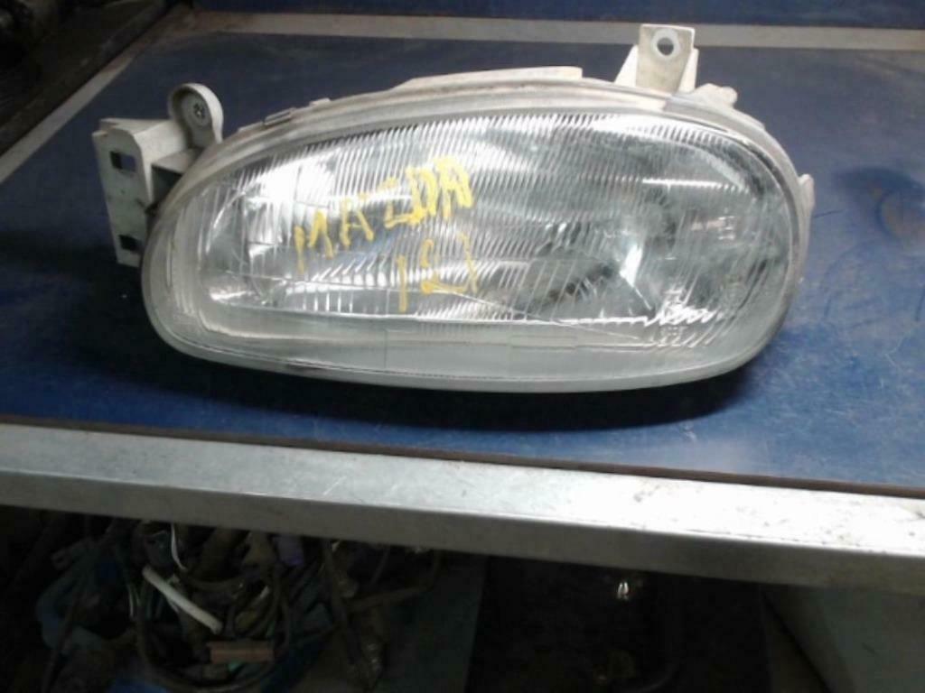 optique avant principal gauche Mazda 121 1999, Ophalen, Gebruikt, Mazda