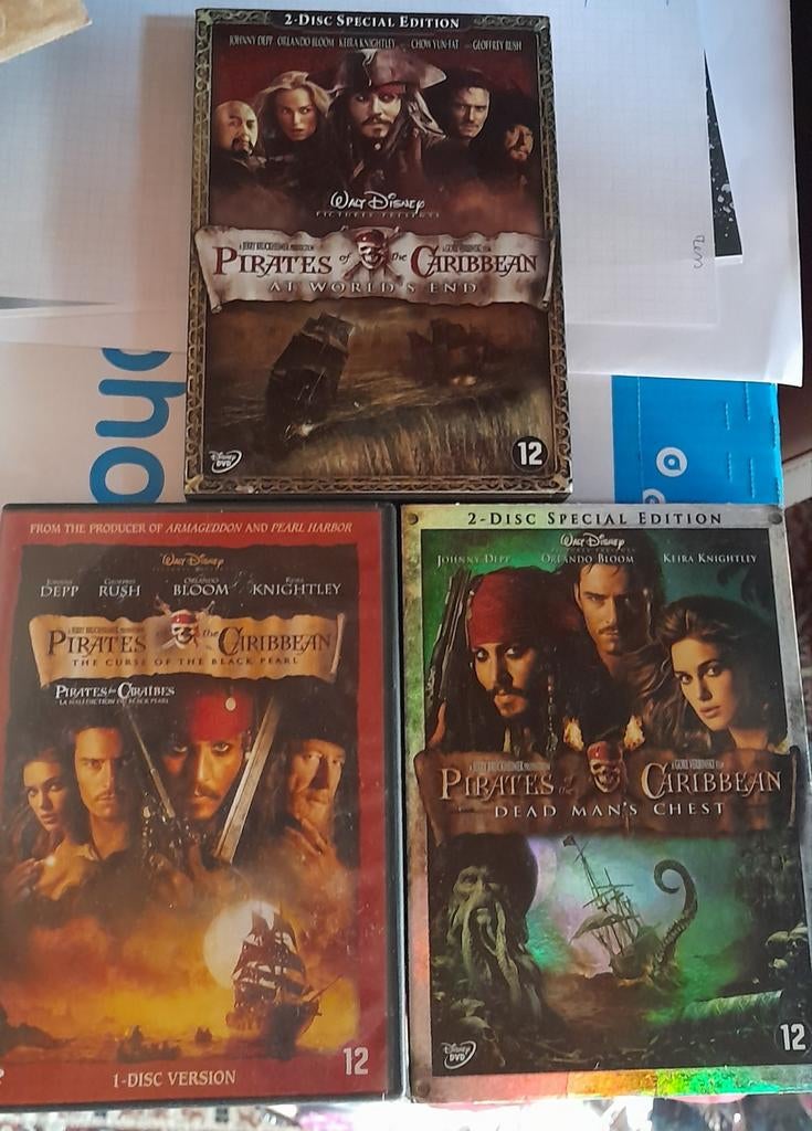 Dvd's  3 films van Pirates of the caribbean, Enlèvement ou Envoi, Comme neuf