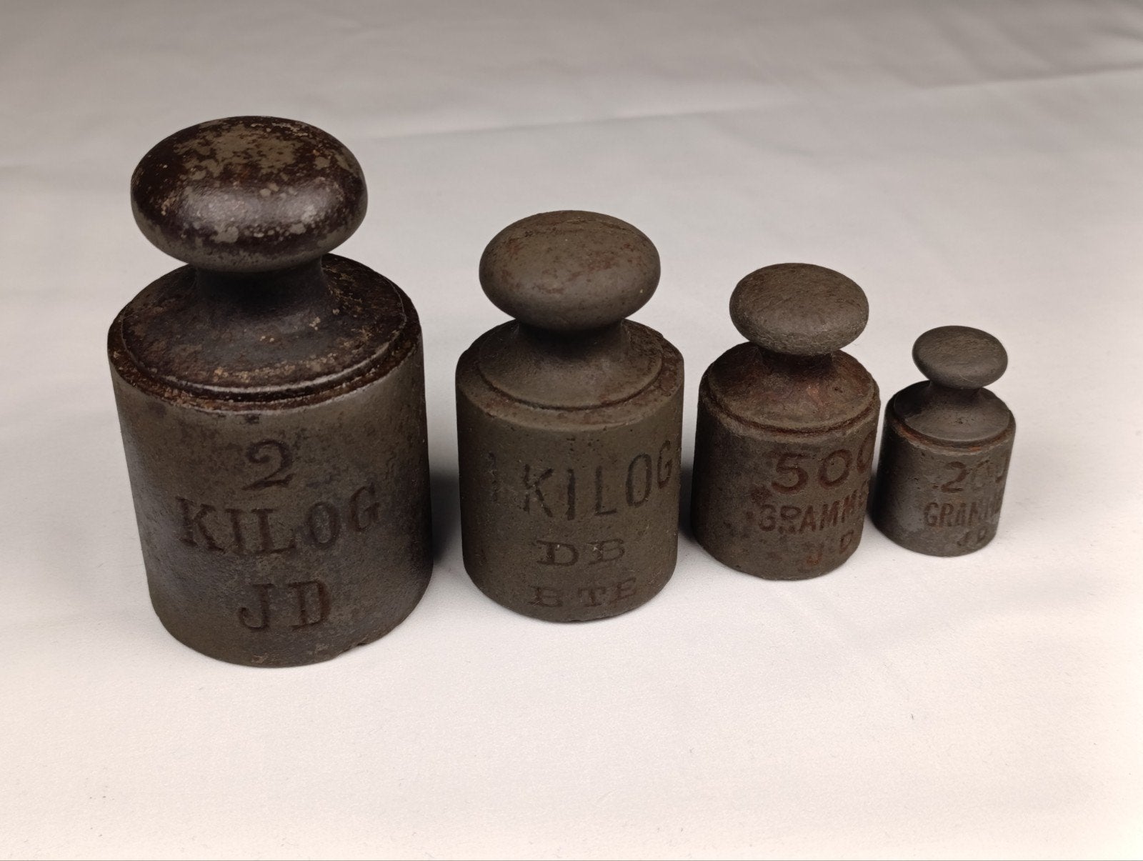 Set van 4 antieke gietijzeren knopgewichten, Antiek en Kunst, Ophalen of Verzenden