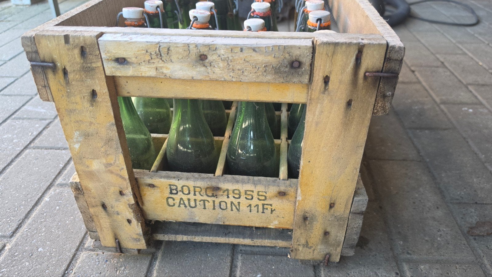 Originele Breda Leuven bierbak 1955 met 24 beugelflessen, Ophalen, Gebruikt, Flesje(s), Overige merken