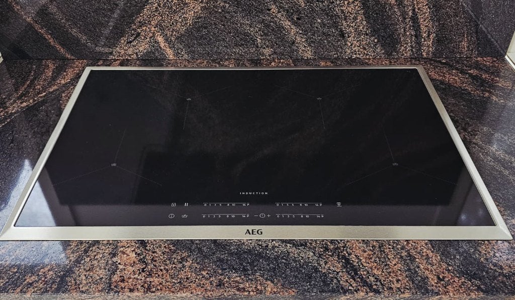 AEG inductiekookplaat IAE84411XB Zwart, Electroménager, Tables de cuisson, Comme neuf, Encastré, 4 zones de cuisson, Classe énergétique A ou plus économe