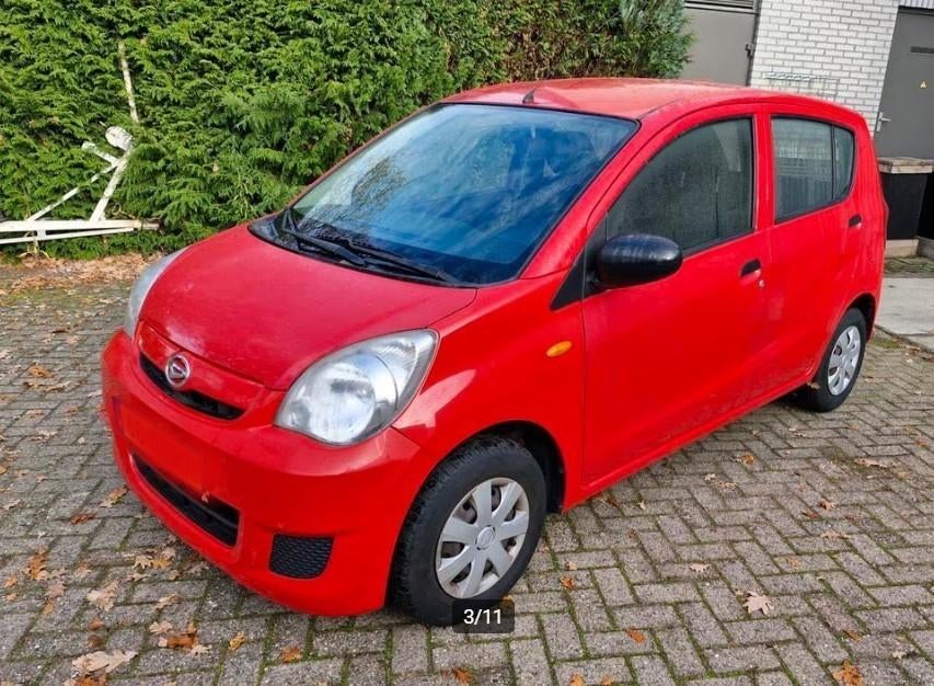 daihatsu cuore 1.0 benzine kleine stads auto 2009, Auto's, Daihatsu, Voorwielaandrijving, Stof, Zwart, Elektrische ramen