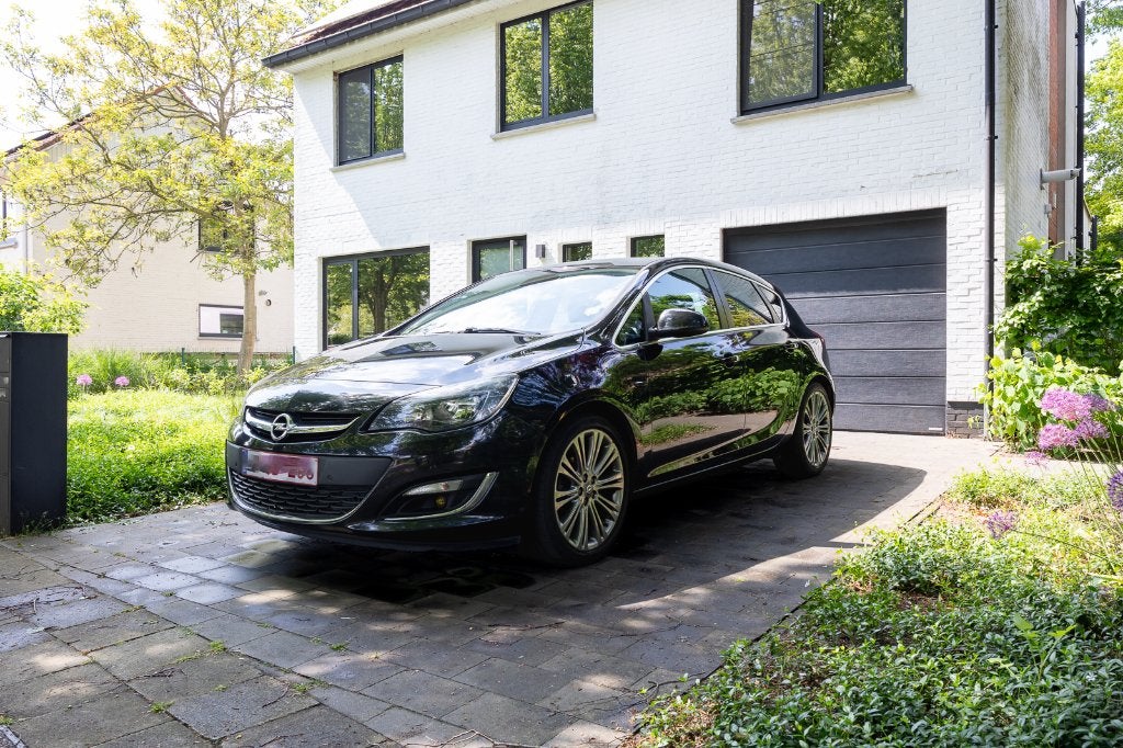 Opel Astra 1.4 Turbo Cosmo edition, Auto's, Achterwielaandrijving, Leder en Stof, Zwart, 5 deurs