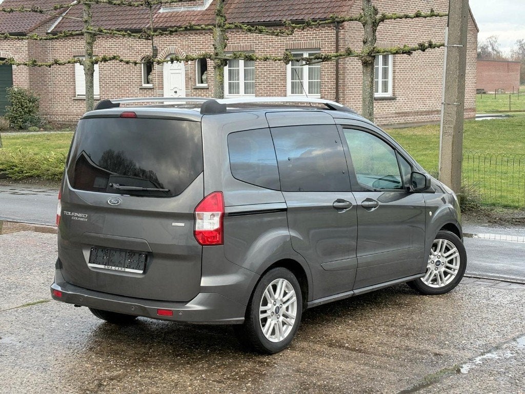 Ford Tourneo Courier 1.0i EcoBoost Titanium Airco Cruise, Auto's, Euro 6, Bedrijf, Handgeschakeld, Parkeersensor
