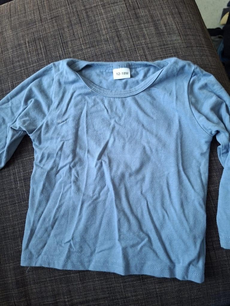 Blauwe T-shirt merkloos, Enlèvement