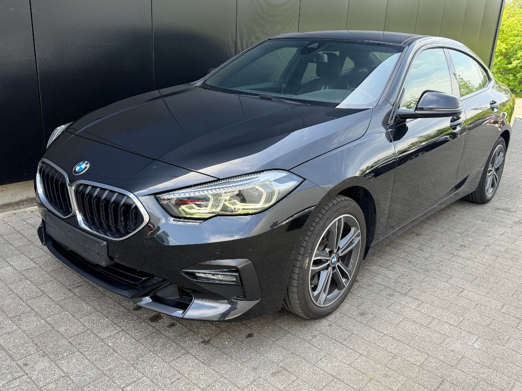 BMW 218i Gran Coupé Automaat–Sport Line–LED–Navi–1j garantie, Auto's, BMW, 1499 kW, Euro 6, Leder en Stof, Zwart