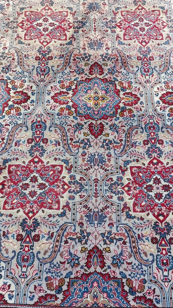 Tapis oriental noué à la main, Enlèvement