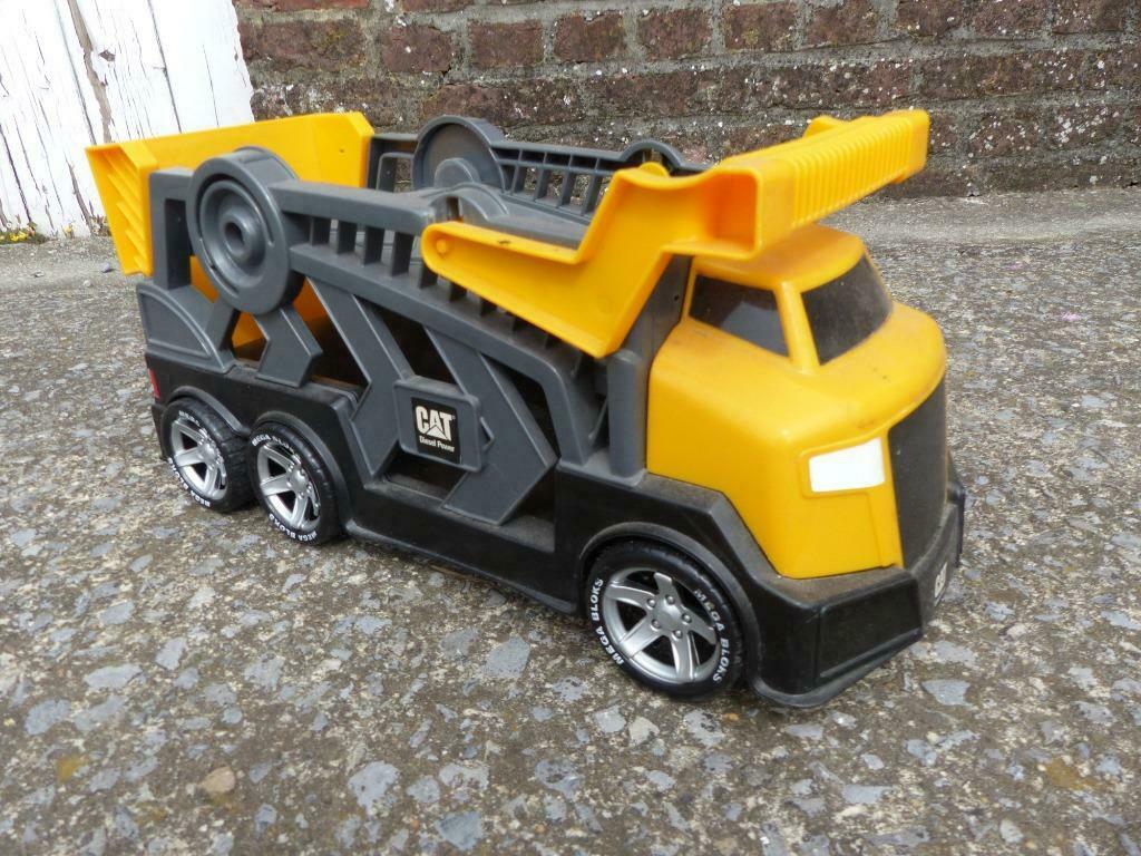 camion transporteur caterpillar, Enlèvement, Utilisé