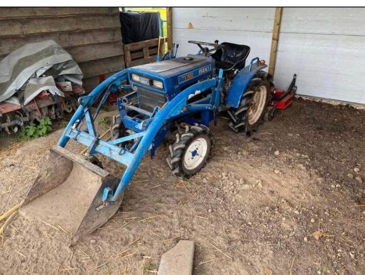 tx1510 met frontlader en frees.