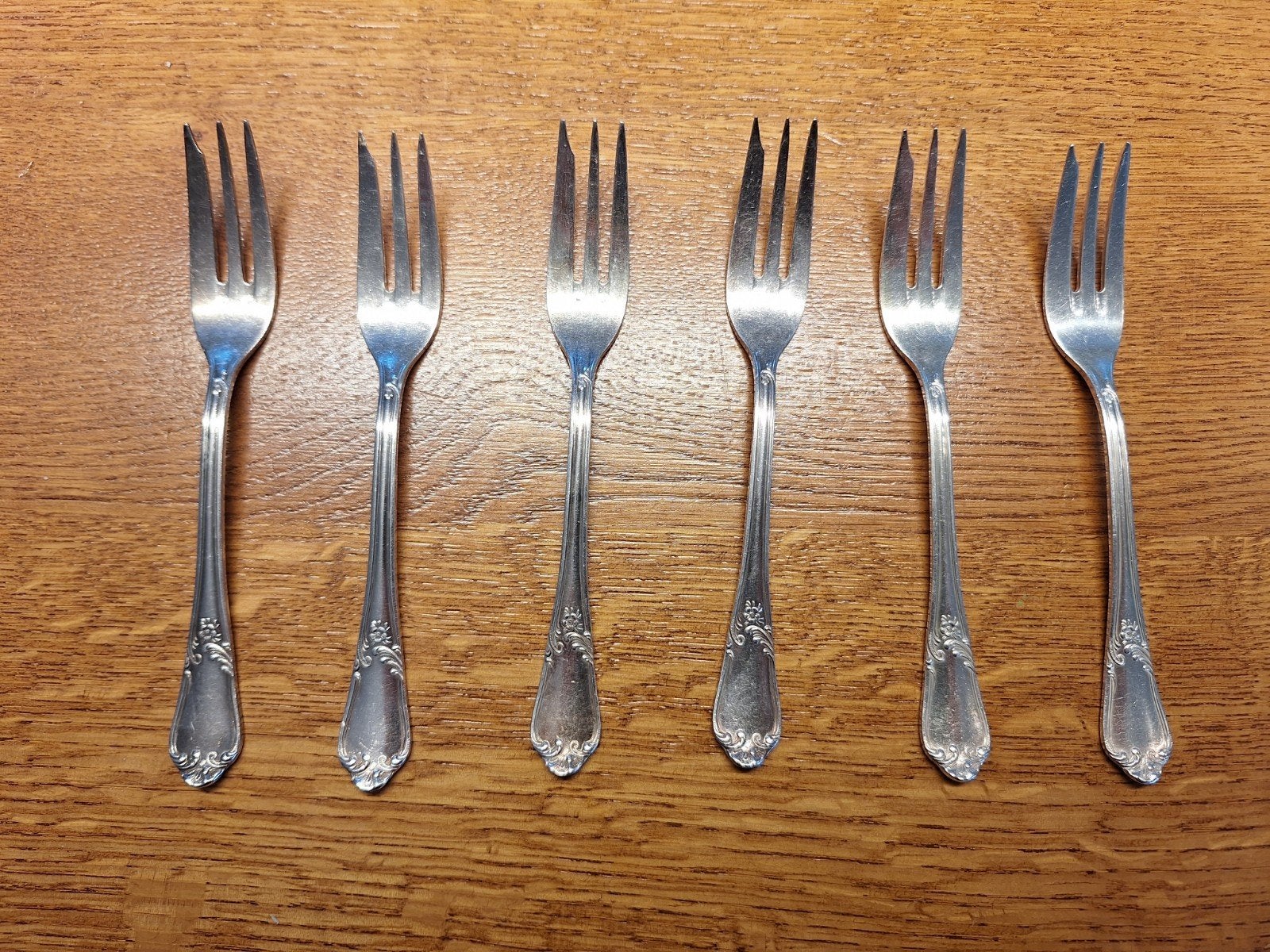 6 verzilverde dessertvorken, Ophalen
