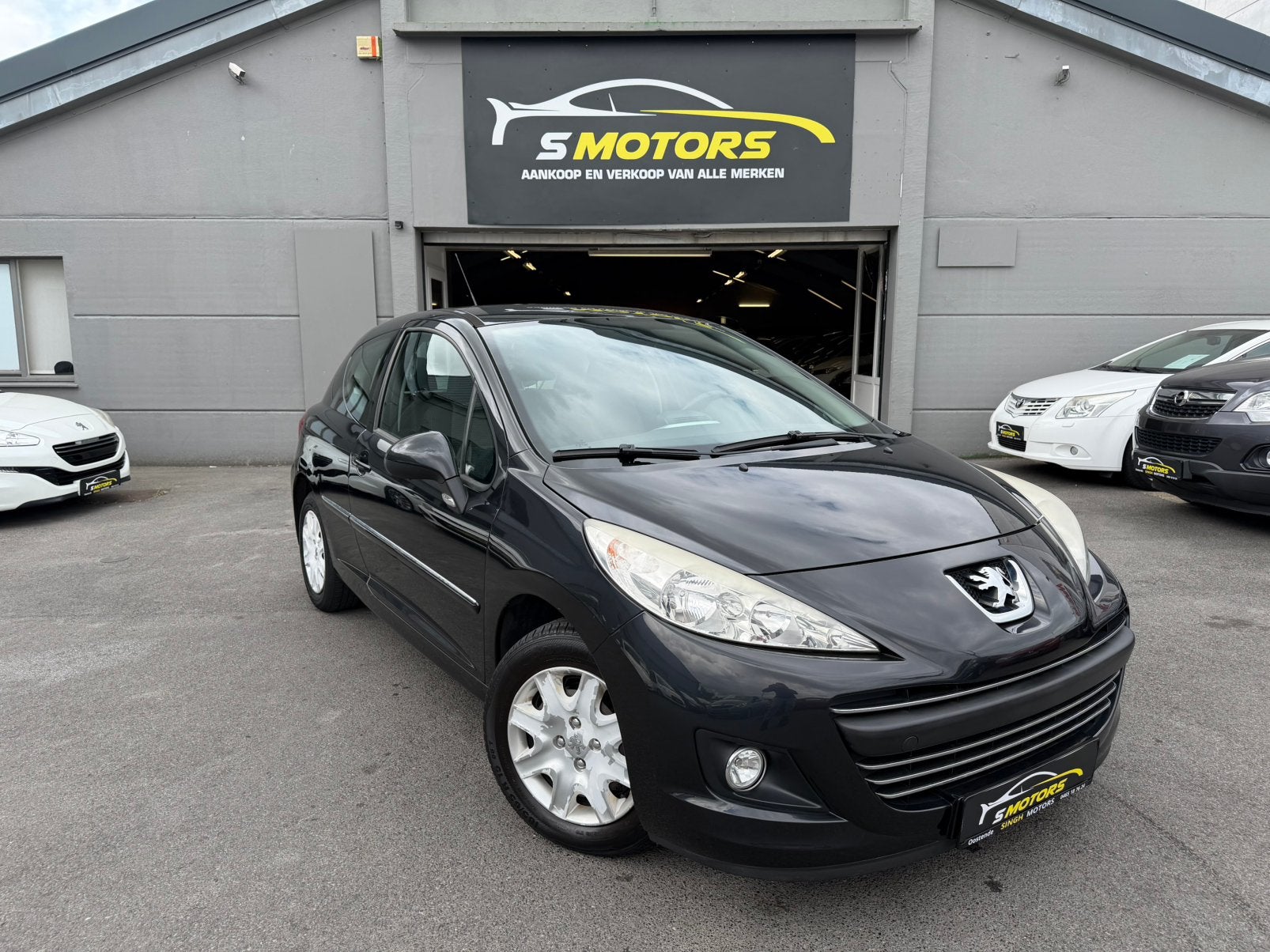 Peugeot 207 1.4i | Airco | Gps | 74.266km | GARANTIE |, Auto's, Euro 5, Stof, Zwart, 1397 cc