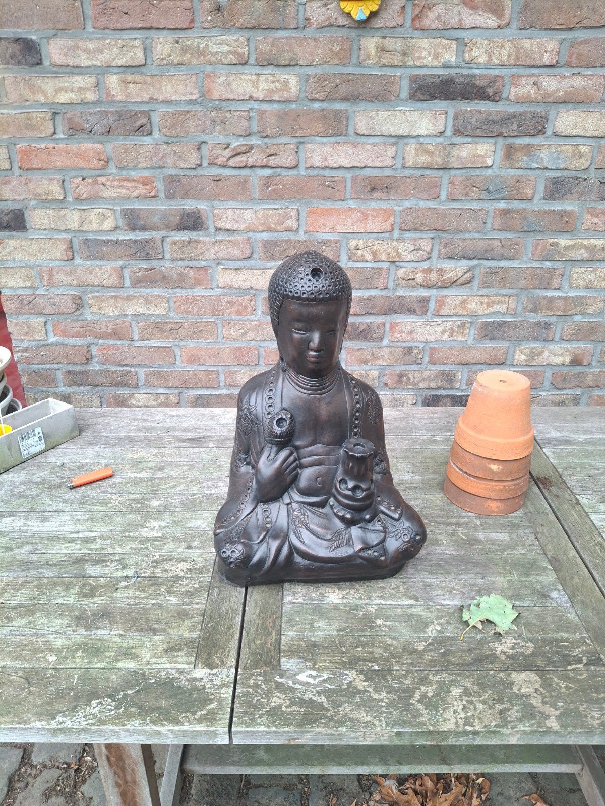 boedha beeld met lotus bloem, Ophalen
