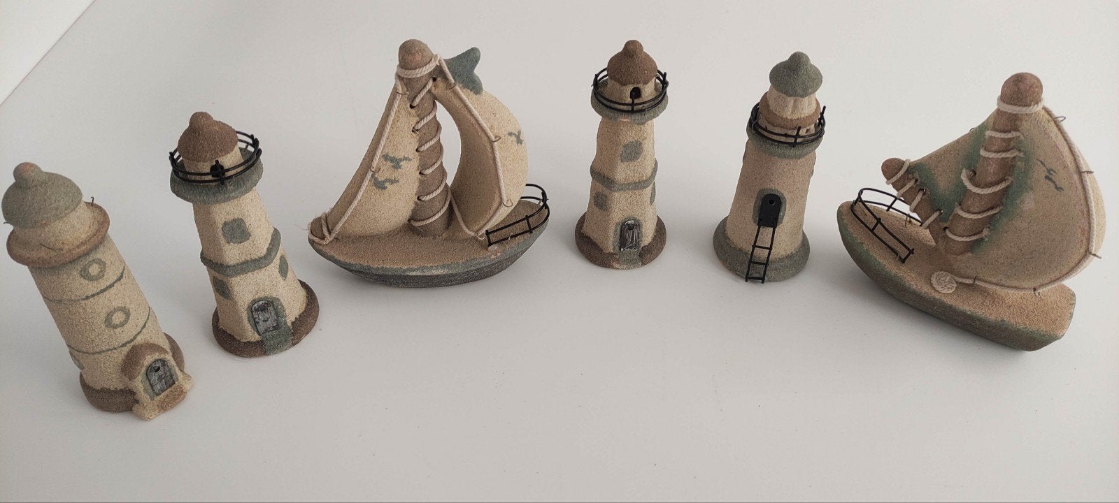 Set decoratieve bootjes en vuurtorens, Ophalen