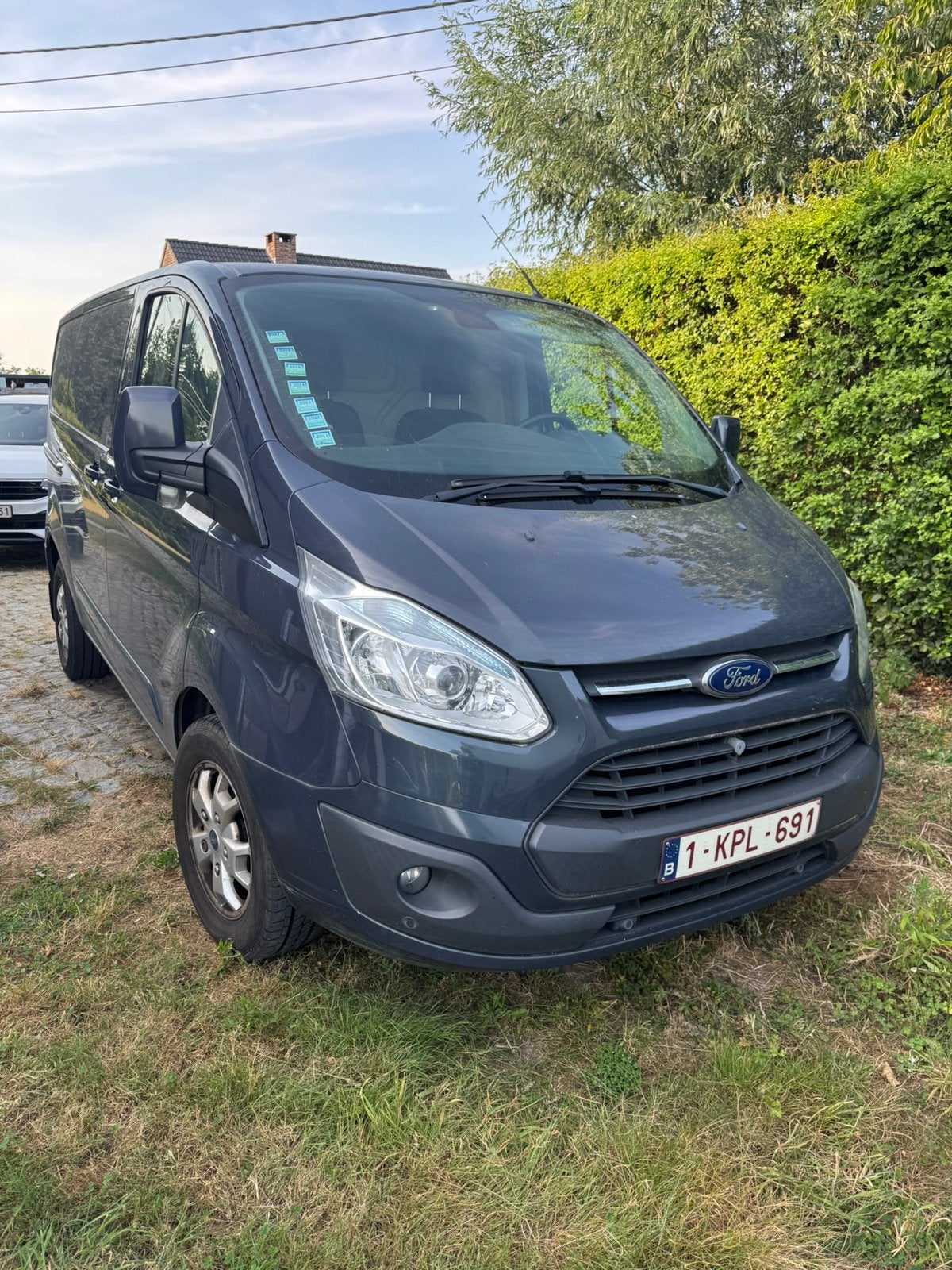 Ford Transit Custom Limited met slechts 68.418 km!, Auto's, 2000 kg, Blauw, Multifunctioneel stuurwiel, Grijs