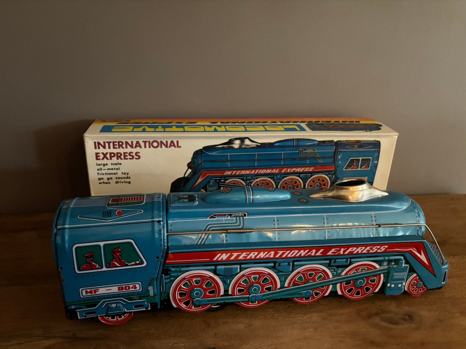 Vintage blikken locomotief "International Express", Antiek en Kunst, Ophalen