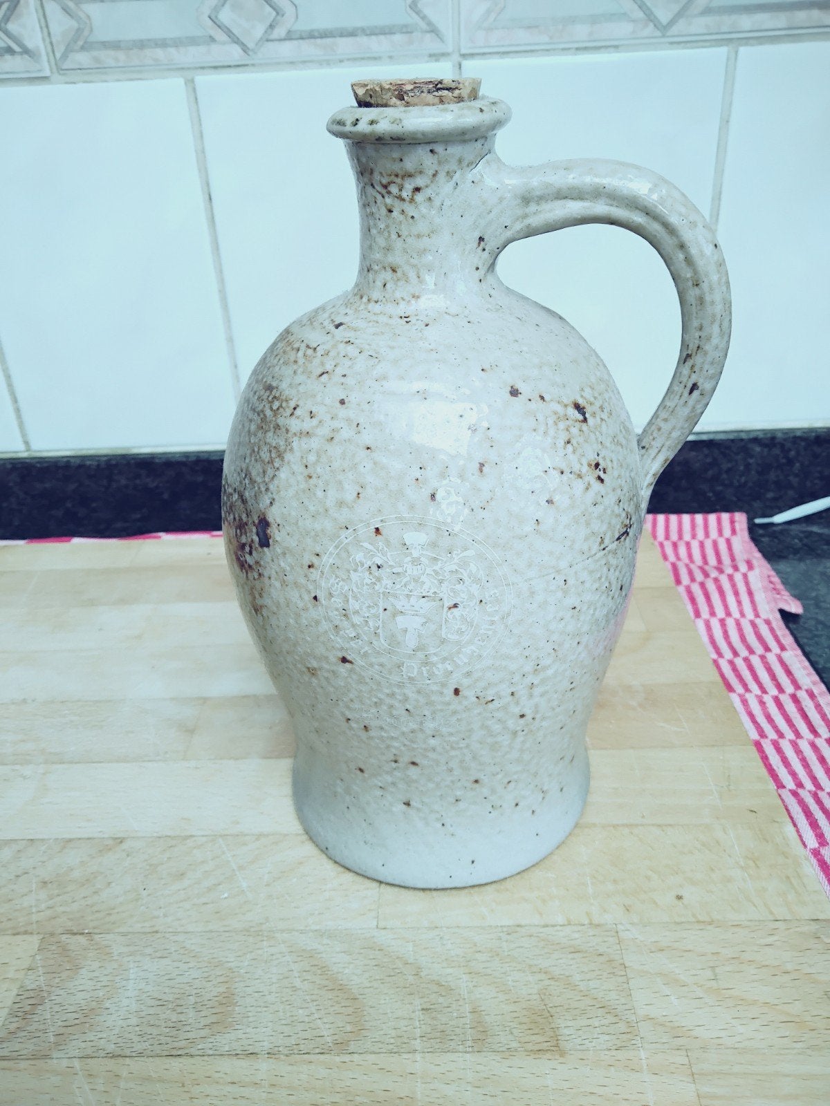 Hasseltse graanjenever kruik, Ophalen