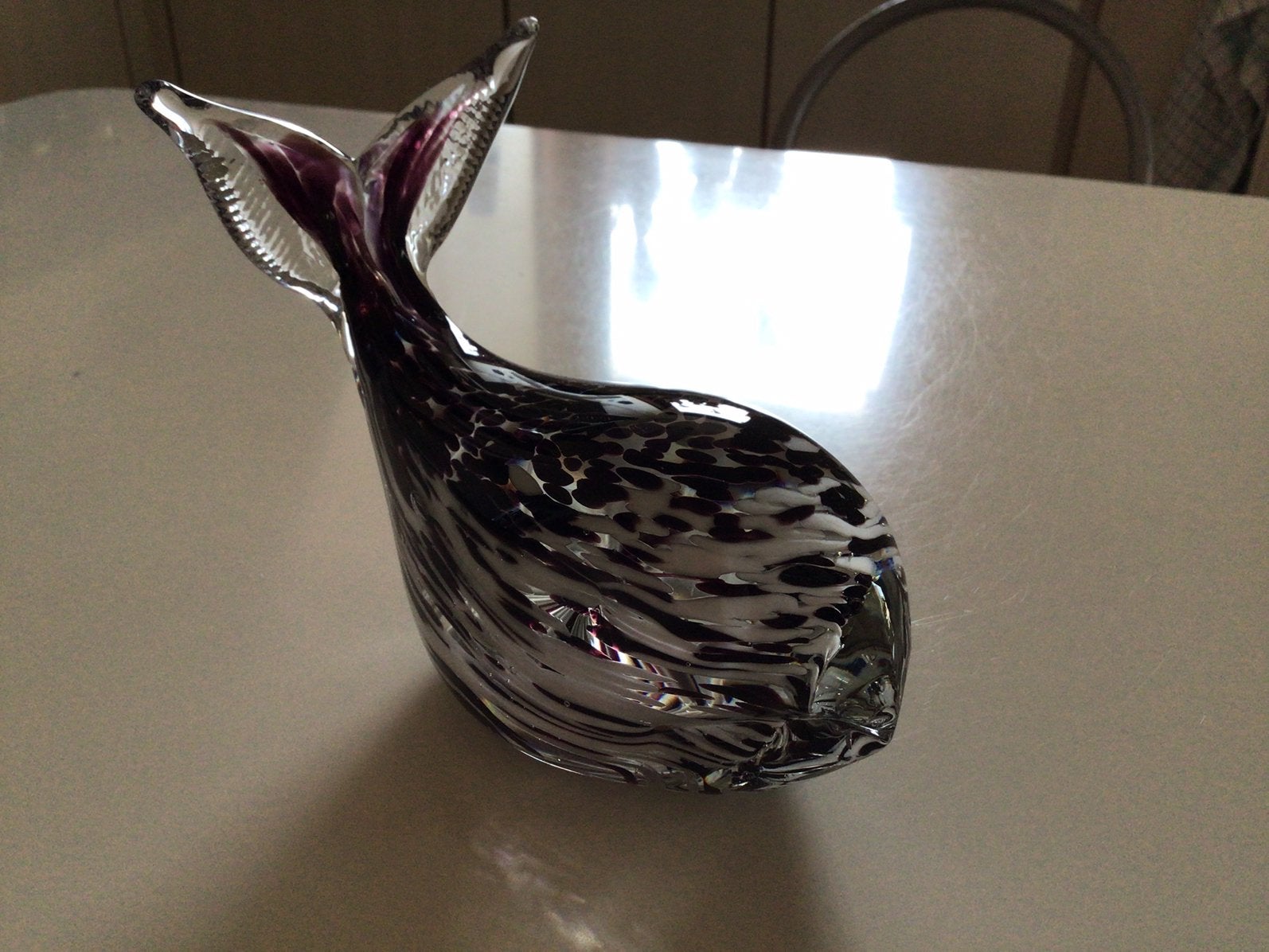 Murano walvis zwart en wit, Ophalen
