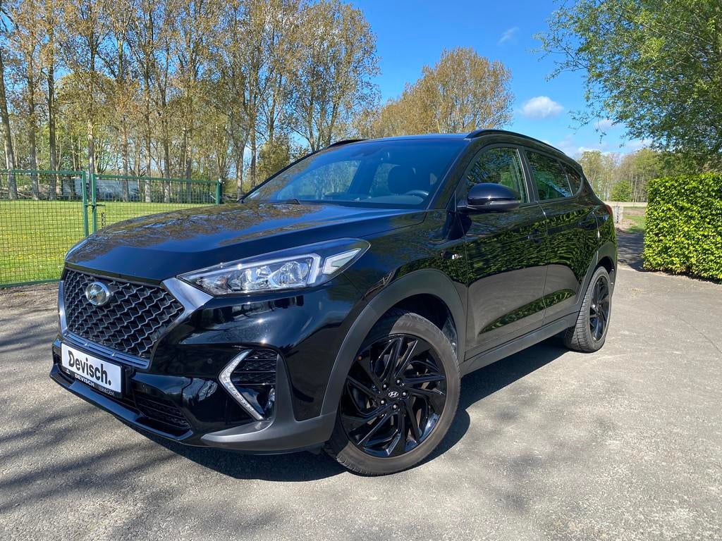 Hyundai Tucson 1.6 t-gdi isg n-line 2wd dct-7 5d 130kw, Gebruikt, 4 cilinders, Leder en Stof, Zwart