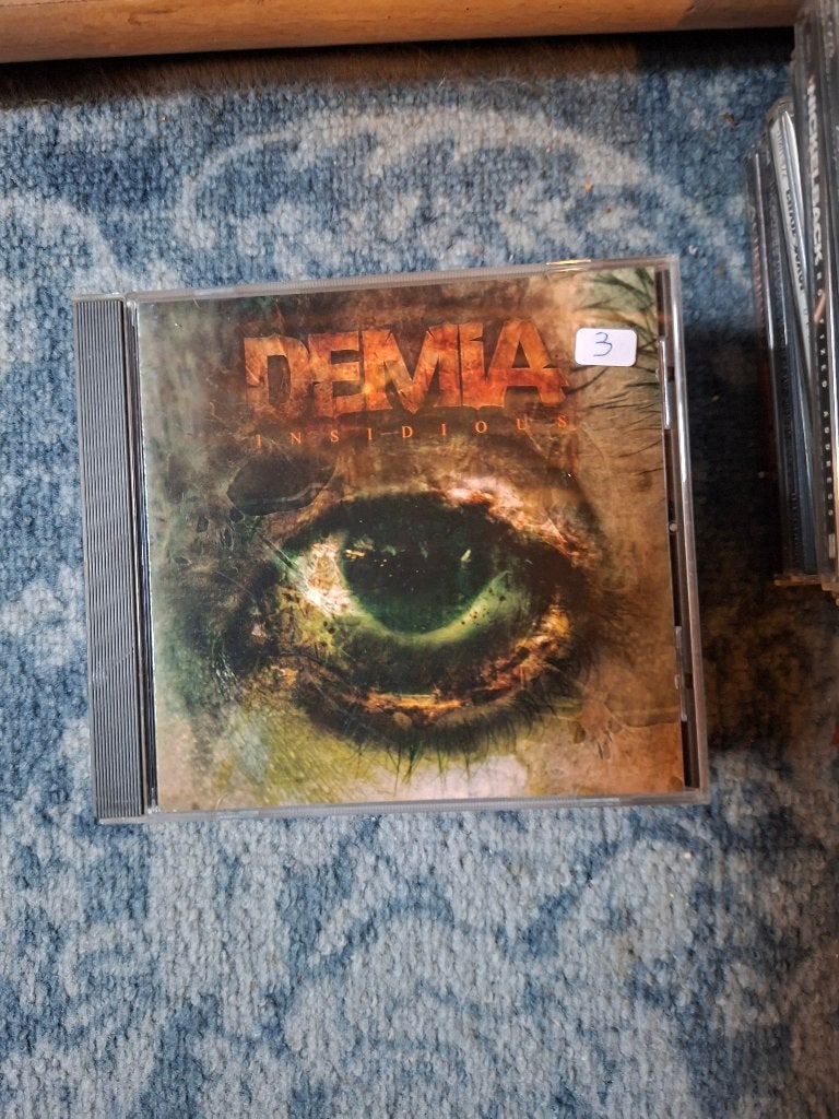 cd - demia - insidious, Ophalen of Verzenden, Zo goed als nieuw, Inclusief boekje, Heavy metal