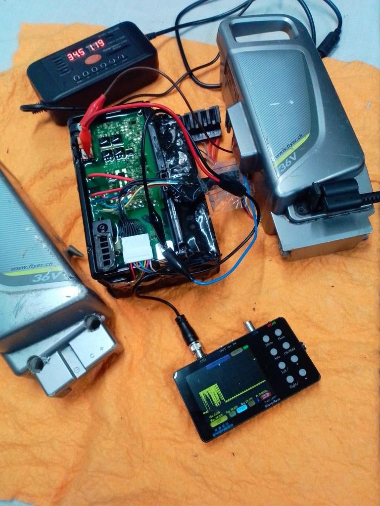 Flyer - BionX batterij 36v - 48v  lader herstelling - testen, Fietsen en Brommers, Ophalen