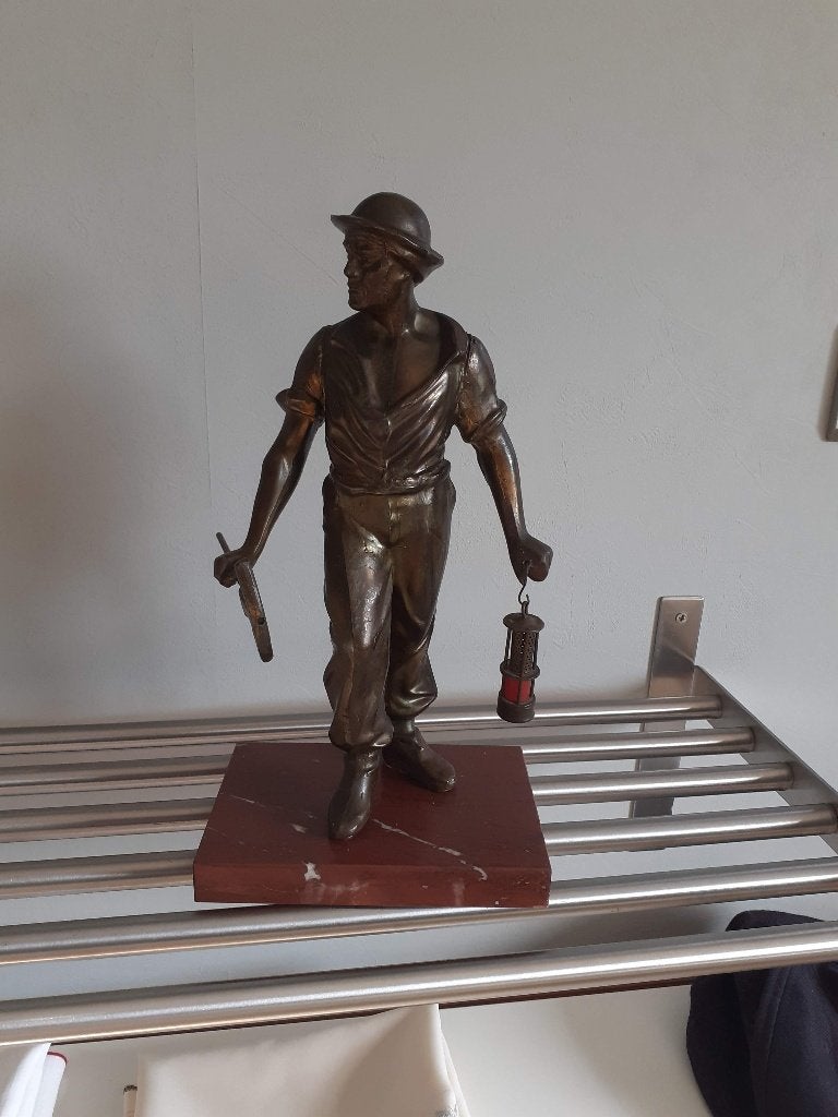 Beeldje mijnwerker mineur, Ophalen