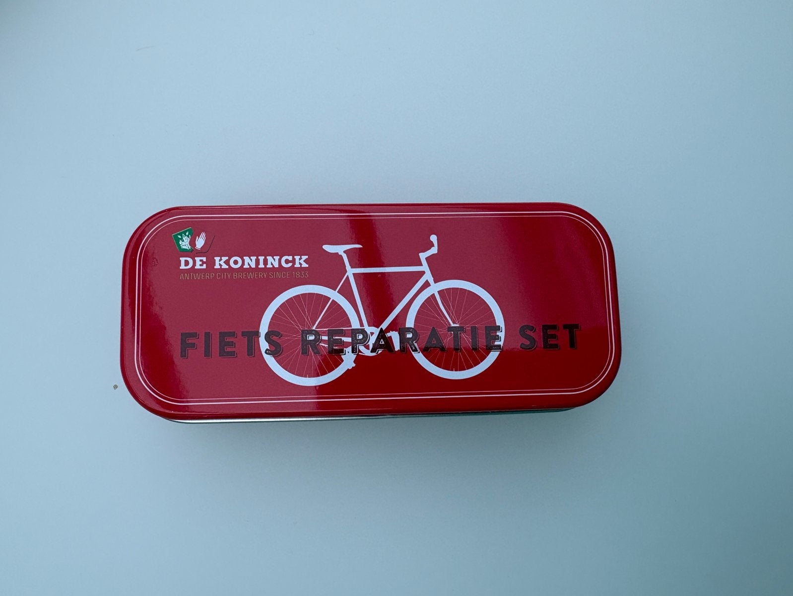 Gadget bier De Koninck fiets reparatie set in blikken doosje, Ophalen of Verzenden, Nieuw, De Koninck