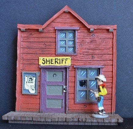 Lucky Luke, figurine en plomb : Le bureau du sheriff (2007)., Enlèvement ou Envoi, Autres personnages, Neuf, Statue ou Figurine