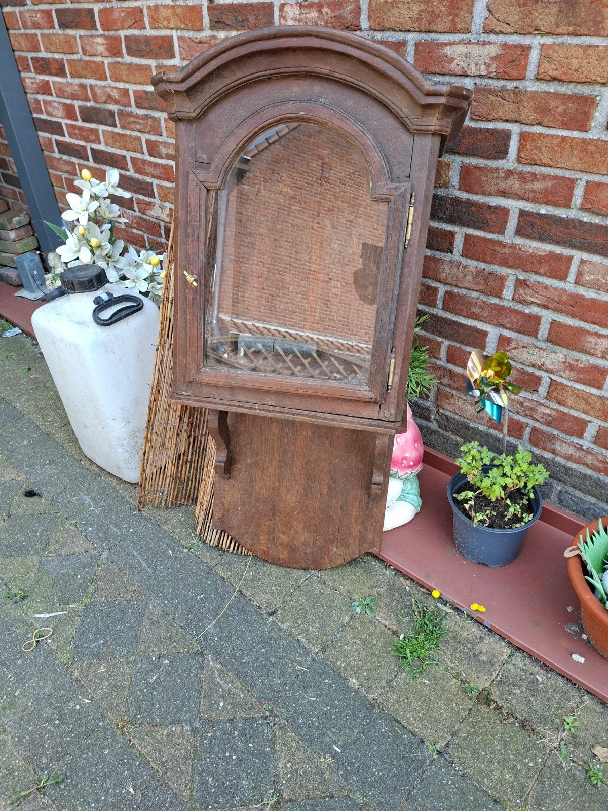 Antieke  lege regelateurkast, Ophalen