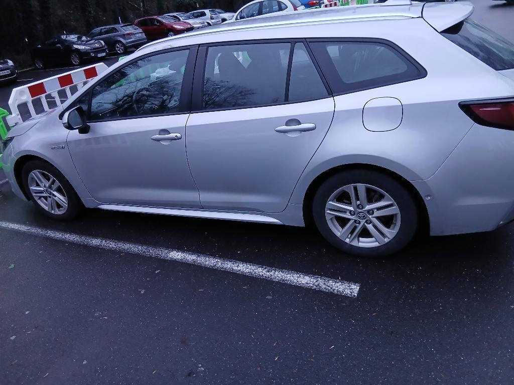 Toyota Corolla hybride stationwagen grijs, Auto's, Toyota, Corolla, Dealer onderhouden, Zilver of Grijs, Te koop
