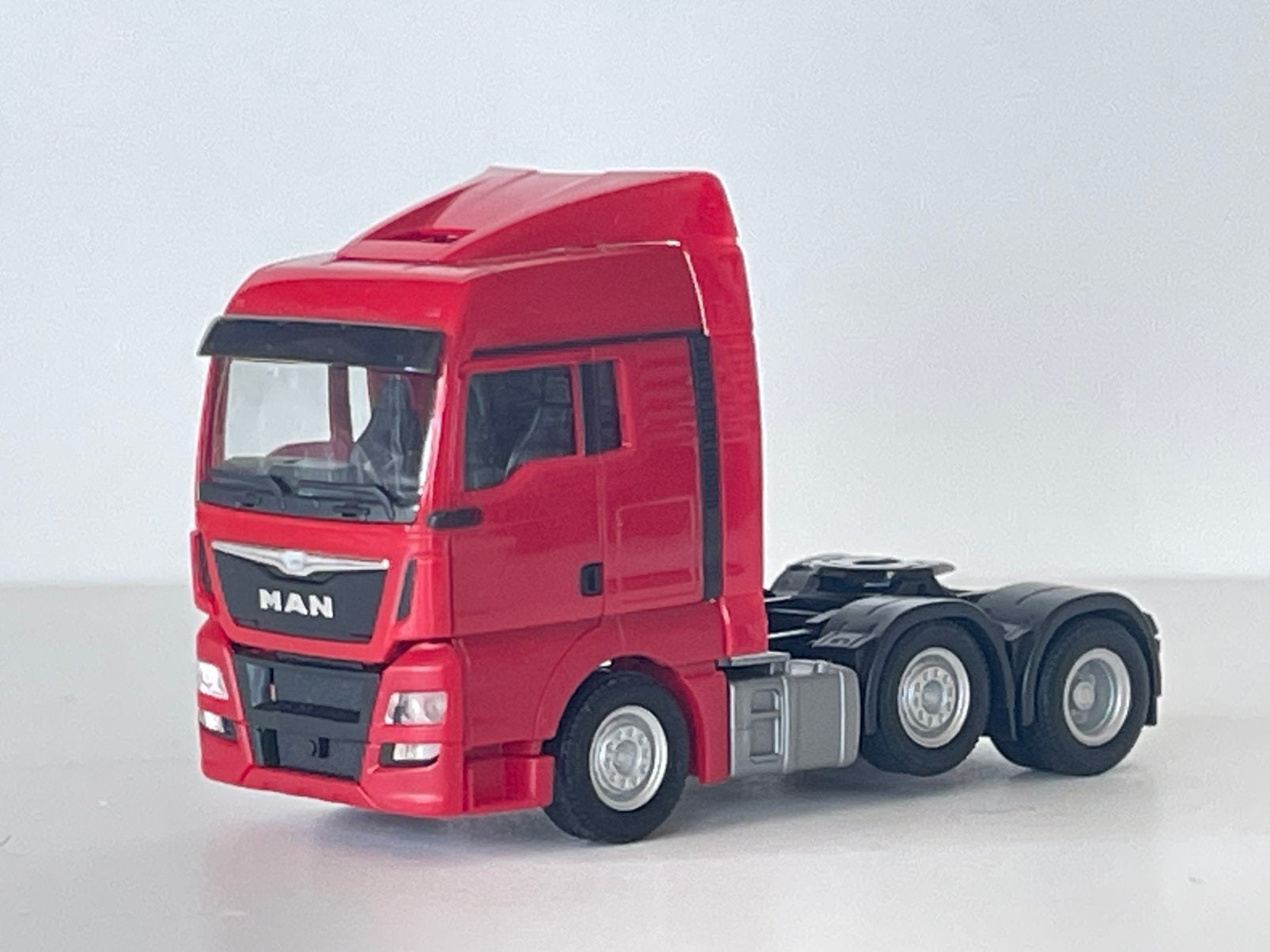 Herpa MAN TGX trekker voorloopas rood 1/87, Enlèvement ou Envoi, Comme neuf, Bus ou Camion, Herpa