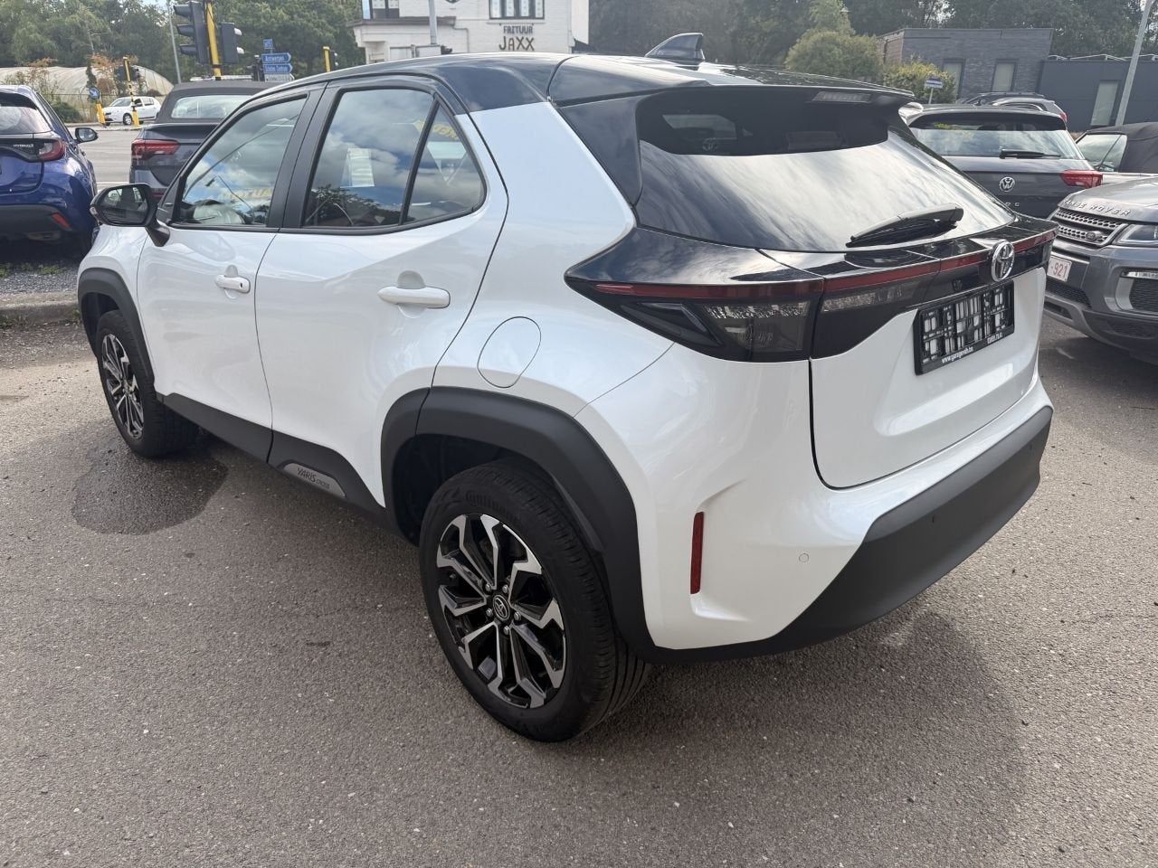Toyota Yaris Cross Hybrid 1.5i VVT-i E-CVT AUTOMAAT 2 JAAR G, Auto's, Stof, Gebruikt, Euro 6, Bedrijf