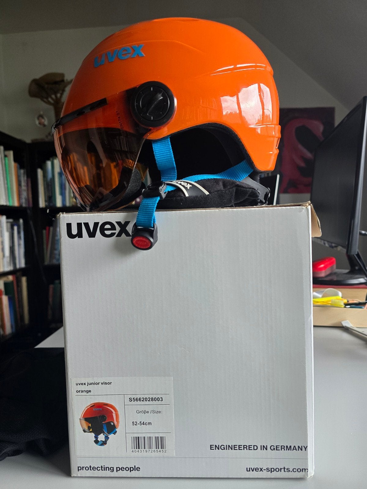 Skihelm junior oranje, Ophalen