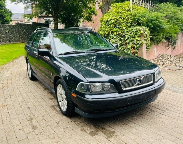 Volvo V40 1.8 Aut., Auto's, Volvo, 4 cilinders, Blauw, Leder en Stof, Bedrijf