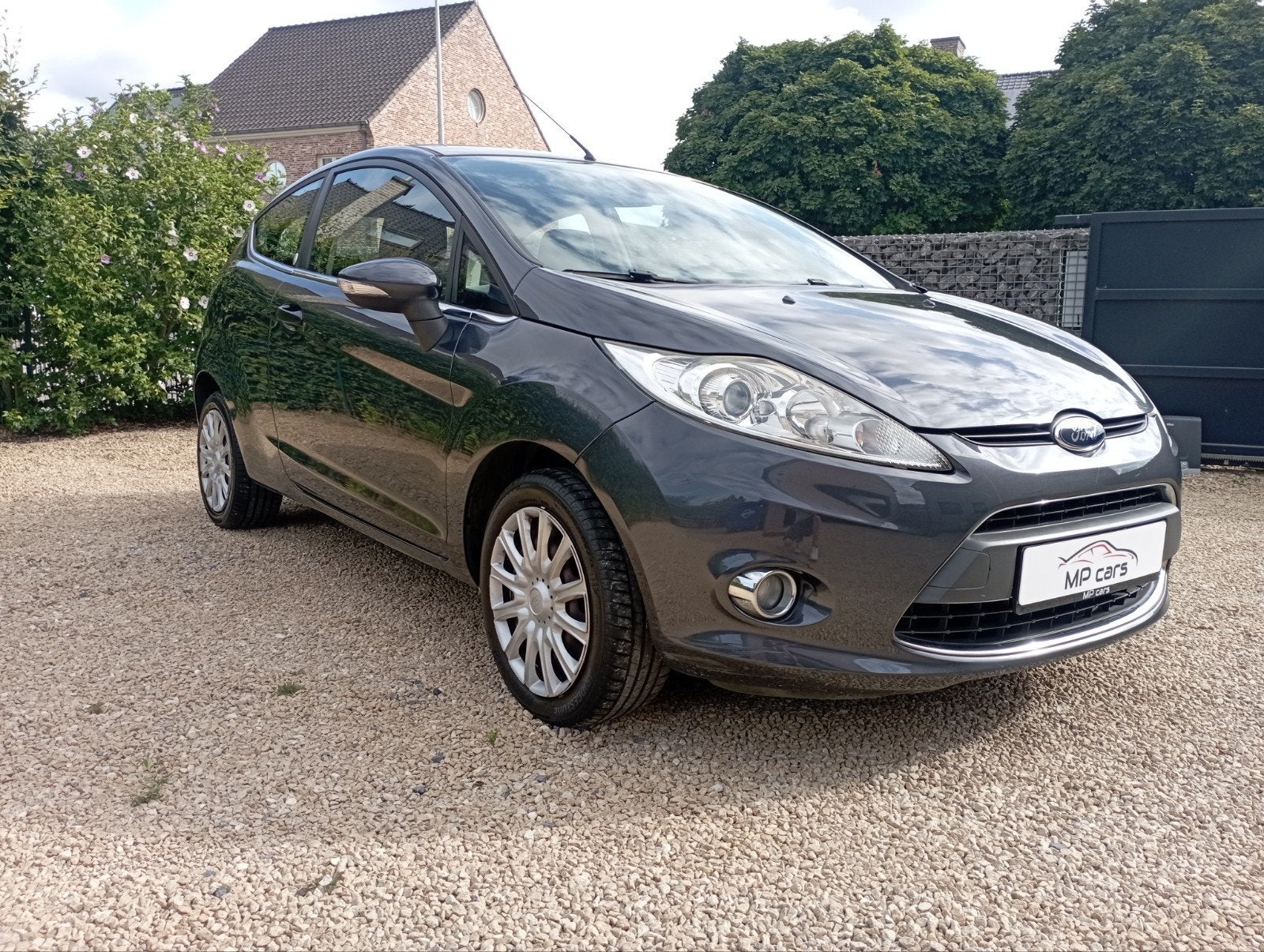 Ford Fiesta Ghia 1.25 Benzine – 2009 – 100.000 km, Auto's, Ford, Stof, 4 cilinders, Radio, Handgeschakeld