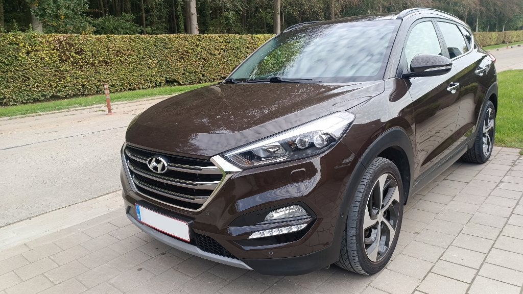 Hyundai Tucson 4WD, Auto's, Dealer onderhouden, 1995 cc, Bruin, Leder