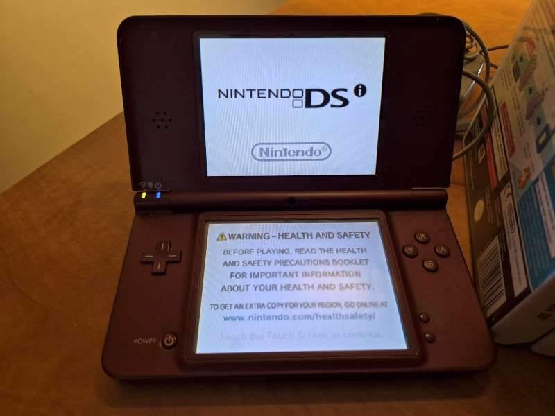 Nintendo DSi XL met spelletjes, Dsi, Ophalen of Verzenden, Rood, Gebruikt