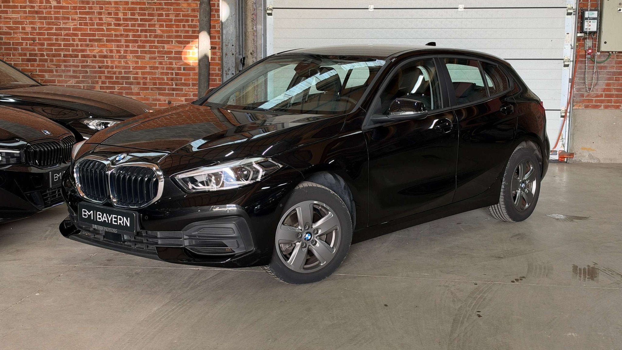 BMW 116 iA | 79.000km | 2023 | Automaat | Benzine | Garant, Auto's, Automaat, Gebruikt, Zwart, Zwart