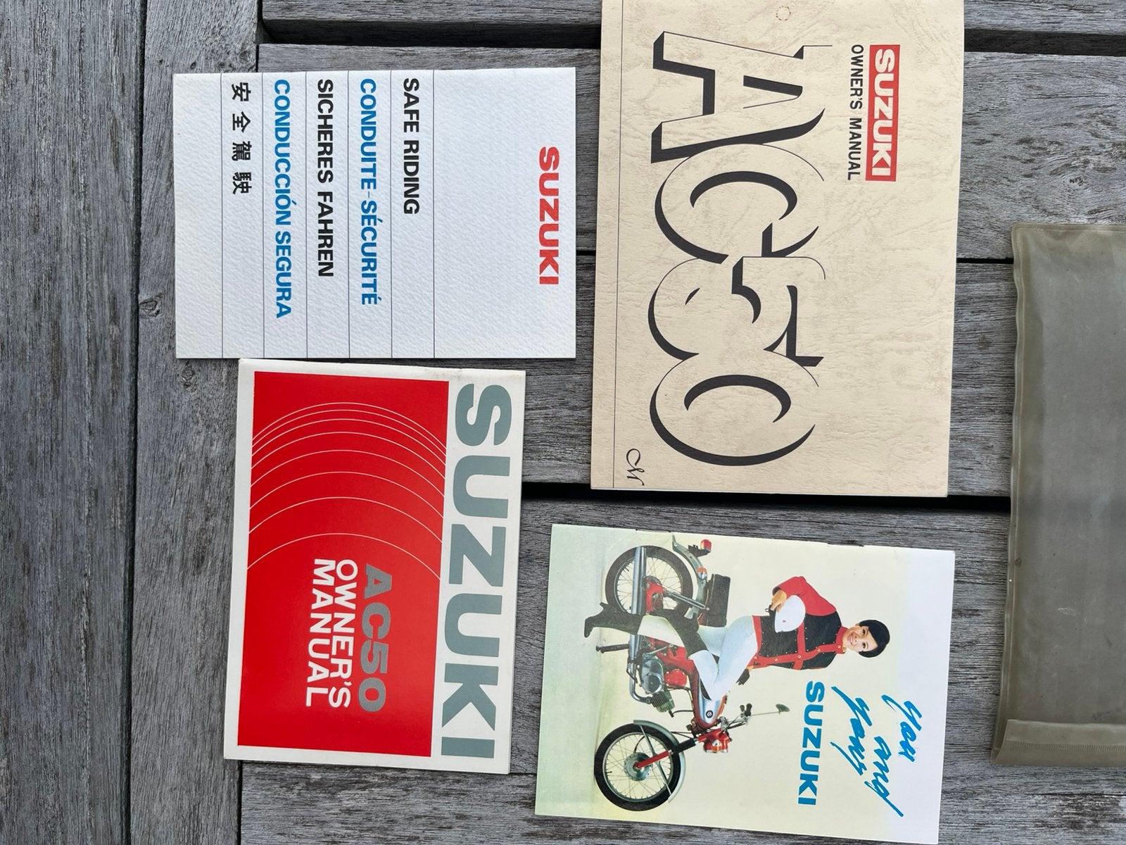 Suzuki AC 50 instructieboekje nieuw, Ophalen of Verzenden