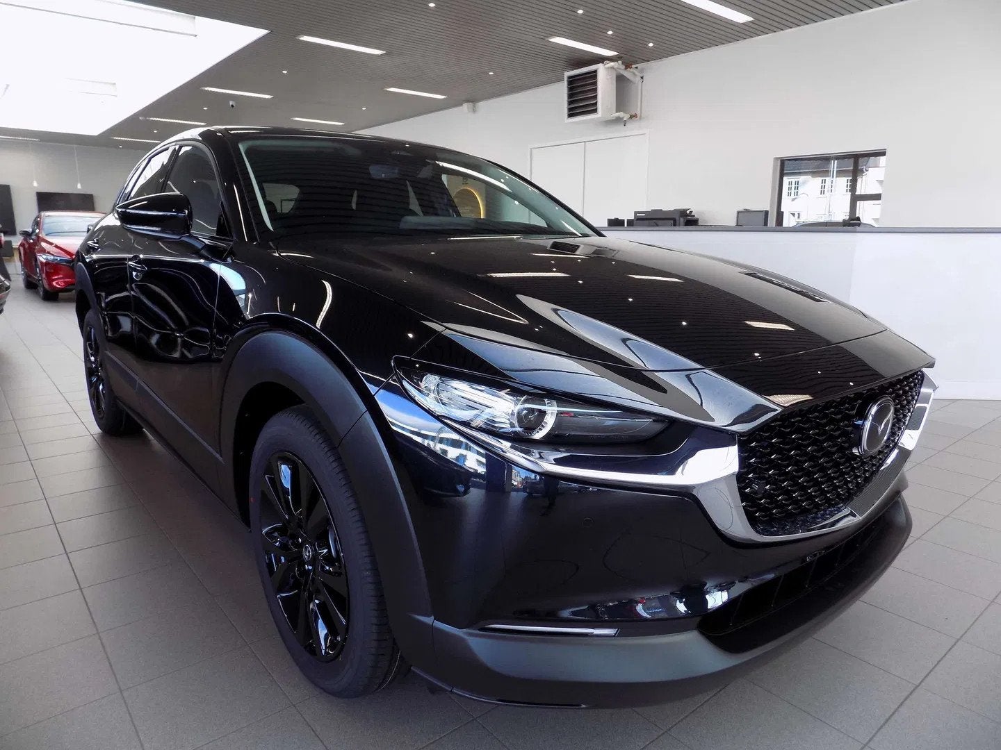 Mazda CX-30 2.0i SKYACTIV-X Homura Automaat, Auto's, Automaat, 1998 cc, Stof, Zwart