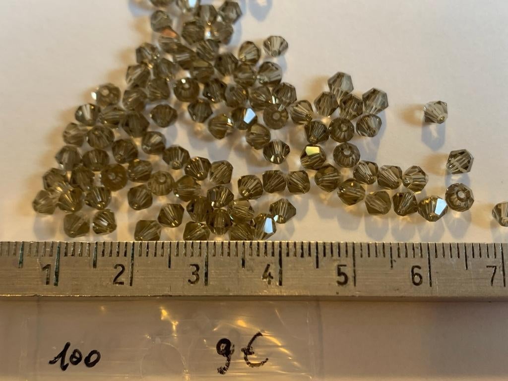 100 Swarovski tolletjes gefumeerd grijs, Ophalen of Verzenden, Nieuw, Kraal