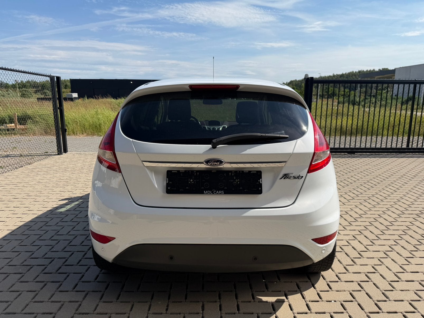 Ford Fiesta 1.25 Benzine - Titanium - Parelmoer wit, Auto's, Ford, Euro 5, Stof, Wit, 5 deurs