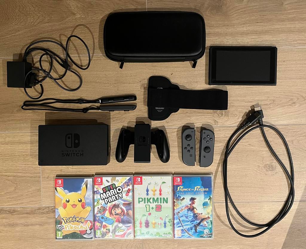 Nintendo switch met toebehoren en spellen, Games en Spelcomputers, Zo goed als nieuw, Met harde schijf, Met 3 controllers of meer