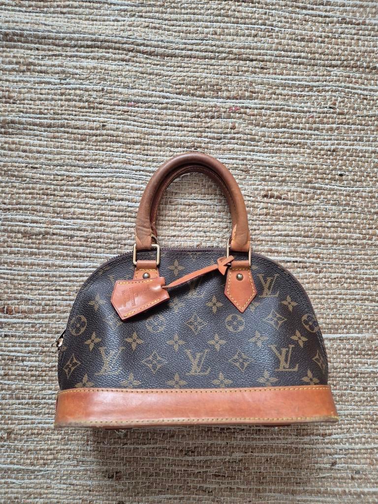 Originele handtas Louis Vuitton, Ophalen