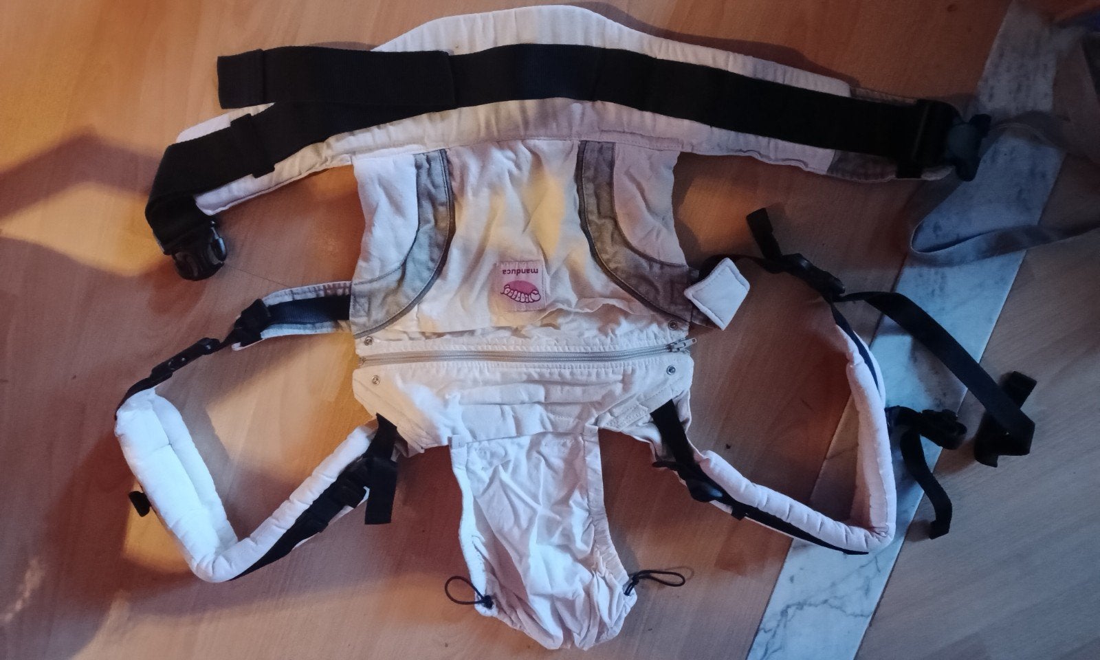 Porte bébé Manduca, Ophalen